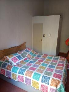 Postel nebo postele na pokoji v ubytování Cabaña hostal Ema