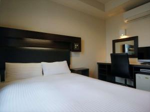 Postel nebo postele na pokoji v ubytování Green Rich Hotel Osaka Airport
