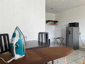 a iron sitting on top of a table in a kitchen at Hotel La Quinta Bonita in Ensenada