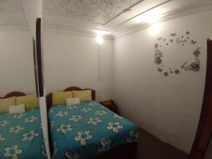 Postel nebo postele na pokoji v ubytování Posada Azul Cusco
