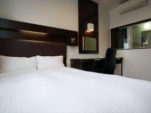 Postel nebo postele na pokoji v ubytování Green Rich Hotel Osaka Airport