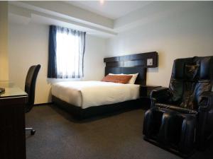 Postel nebo postele na pokoji v ubytování Green Rich Hotel Osaka Airport