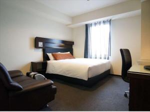 Postel nebo postele na pokoji v ubytování Green Rich Hotel Osaka Airport