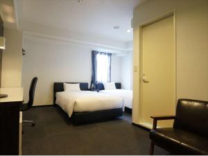 Postel nebo postele na pokoji v ubytování Green Rich Hotel Osaka Airport