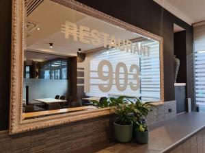 a restaurant with a mirror on the wall at Great Southern Hotel Perth in Perth