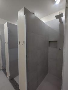 a bathroom with a shower stall and a sink at Soul Hostel Av Paulista Bela Vista 2 in Sao Paulo