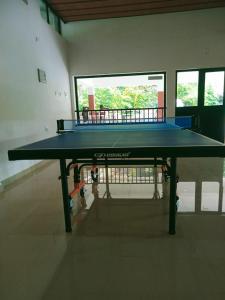 a large ping pong table in a room at Rockdale Resort in Nilambūr