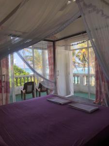 מיטה או מיטות בחדר ב-SunRay Rest - Beach View Homestay