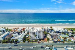 an aerial view of a city and the beach at Beach Palms Holiday Apartments in Gold Coast