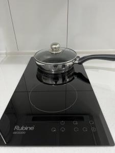 a pot sitting on top of a stove at Aha Horizon Suites in Sepang