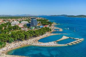 an aerial view of a beach and the ocean at Apartments Slavica - free WiFi in Vodice
