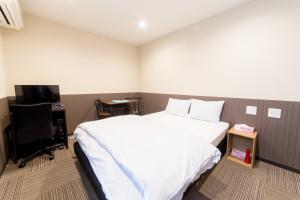 Uma cama ou camas num quarto em Le Studio 五条高倉