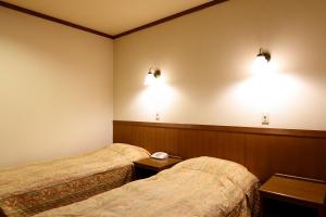 Postel nebo postele na pokoji v ubytování Heidihof Hotel