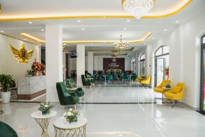 a lobby of a hotel with chairs and tables at Le Phan Hotel in Tây Ninh