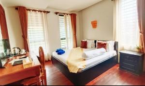 Een bed of bedden in een kamer bij Baan Soksan