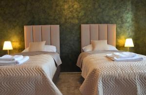 A bed or beds in a room at TATRANSKY DOM sk