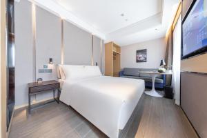 Postel nebo postele na pokoji v ubytování Atour Hotel Xiaolan Zhongshan