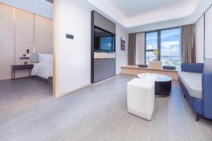 TV a/nebo společenská místnost v ubytování Atour Hotel Xiaolan Zhongshan