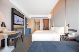 Postel nebo postele na pokoji v ubytování Atour Hotel Xiaolan Zhongshan