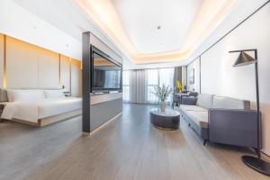Postel nebo postele na pokoji v ubytování Atour Hotel Xiaolan Zhongshan