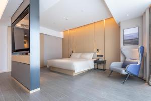 Postel nebo postele na pokoji v ubytování Atour Hotel Xiaolan Zhongshan