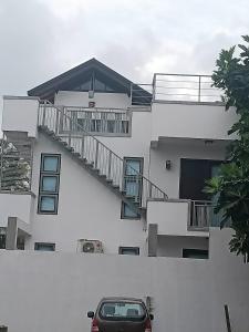 a car parked in front of a building with stairs at Villa Suyara Rooftop,,, in Panadura