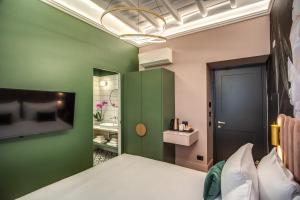 Posteľ alebo postele v izbe v ubytovaní Palazzetto Trevi