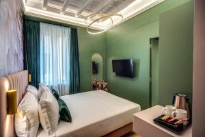 Posteľ alebo postele v izbe v ubytovaní Palazzetto Trevi