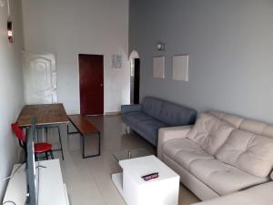 a living room with a couch and a table at HOMY APARTAMENTOS #8 - Apt Grande G12 Agora Corferias embassy UN in Bogotá