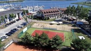 an aerial view of a tennis court next to a marina at Hotel Galion in Gdańsk