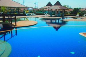 a large pool with blue water in a resort at Mae Phim Villa BR64 by Sun4U in Ban Bua Phut