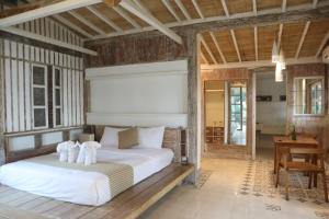 Postel nebo postele na pokoji v ubytování Aventus Resort Ubud + 22 fotografií