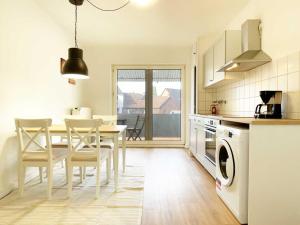 a kitchen and dining room with a table and chairs at Cosy & Central-Apartments in Gelsenkirchen in Gelsenkirchen