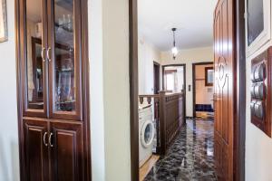 a kitchen with a washer and dryer in a house at Oceanviewvilla in Karpathos