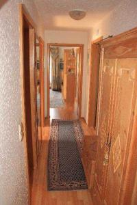 a hallway of a home with a rug on the floor at Hirschenhof in Breitnau