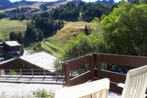 a view from the balcony of a house in the mountains at Apt With Garden In La Plagne in La Plagne