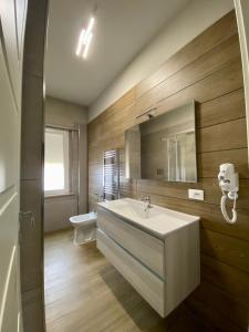 a bathroom with a sink and a toilet at Morelli B&B in Rossano Stazione