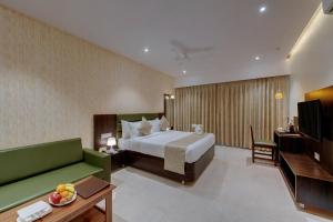 Guruprerna Beacon Resort, Dwarka客房内的一张或多张床位