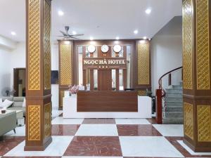 a lobby of a hotel with a reception desk at Khách sạn Ngọc Hà in Lao Cai