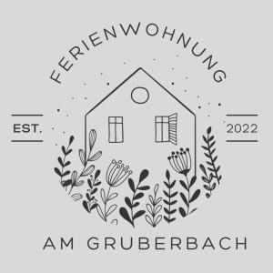 un logotipo para un taller de jardinería con una casa y flores en Ferienwohnung am Gruberbach, en Lechbruck