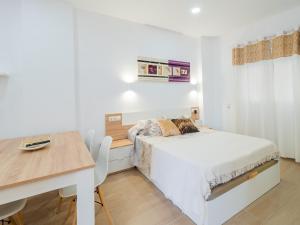 Posteľ alebo postele v izbe v ubytovaní Cubo's Urban Studio Turisbelen