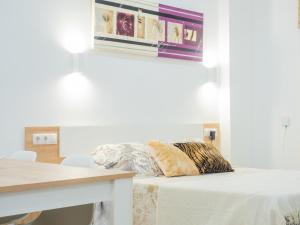 Posteľ alebo postele v izbe v ubytovaní Cubo's Urban Studio Turisbelen