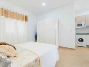 Posteľ alebo postele v izbe v ubytovaní Cubo's Urban Studio Turisbelen