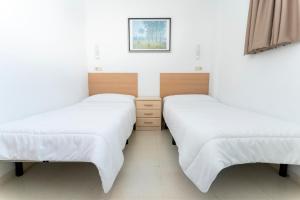 Cama o camas de una habitación en Albergue Inturjoven Sierra Nevada