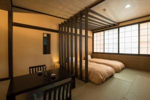 Voodi või voodid majutusasutuse Takamiya Hotel Lucent toas