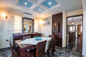 a dining room with a table and chairs at Oceanviewvilla in Karpathos
