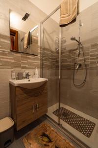 a bathroom with a sink and a shower at Sole Luna B&B in Pescara