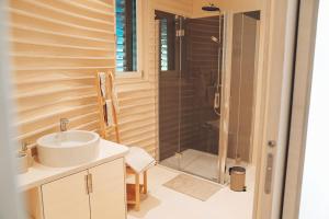 a bathroom with a sink and a shower at Floater in Dudelange