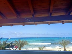 a view of the beach from a resort at Sal&Love apt in Porto Antigo in Santa Maria