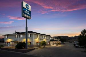 a building with a sign in a parking lot at Best Western Richfield Inn in Richfield